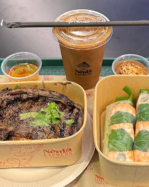 Vietnamese iced coffee cà phê sữa đá with a rice plate and summer rolls at Nón Lá Express