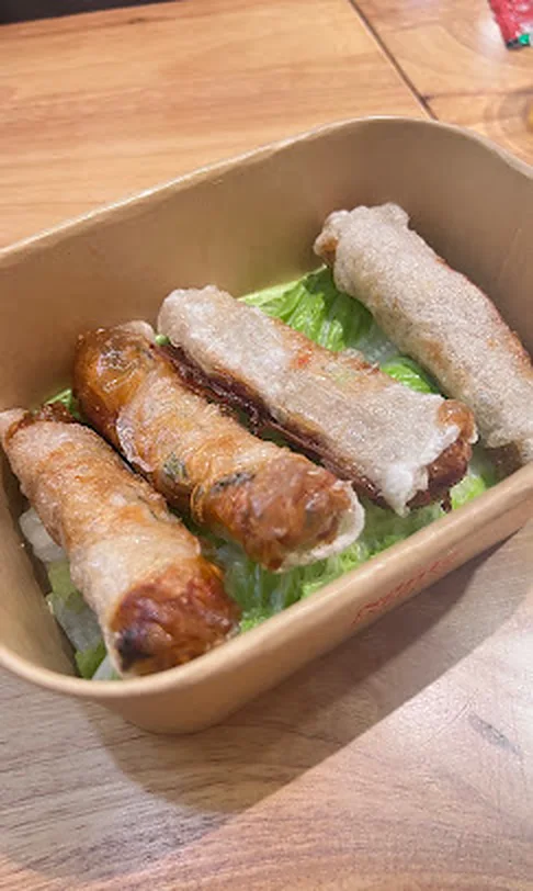 Crispy spring rolls - Chả Giò Golden crispy Vietnamese spring rolls, chả giò, in a Nón Lá Express takeout box