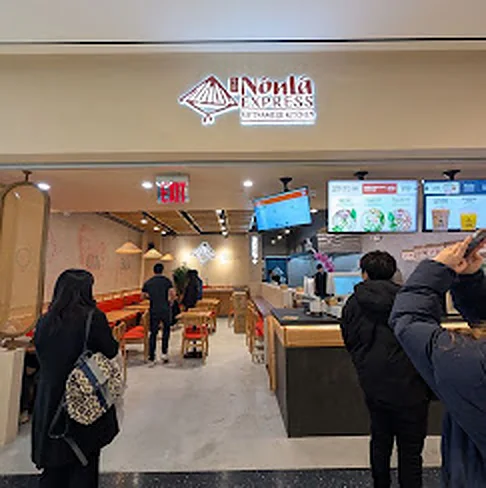 Guests ordering at the Nón Lá Express stall entrance inside Tangram Food Hall, Flushing Queens