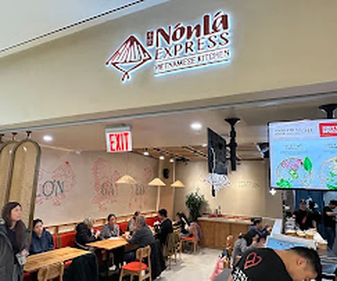 Nón Lá Express Vietnamese Kitchen illuminated sign above the dining area in Tangram Food Hall, Flushing