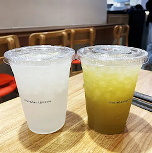 Salted limeade chanh muối and fresh sugarcane juice nước mía in Nón Lá Express cups