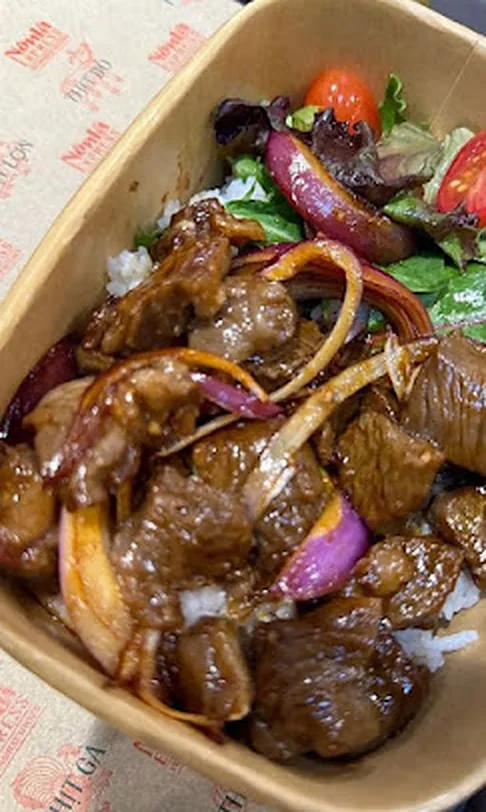 Shaking Beef Rice - Bò Lúc Lắc Shaking beef bò lúc lắc wok-seared with red onions and peppers at Nón Lá Express
